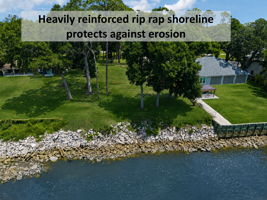 A heavily reinforced riprap shoreline helps protect the property from erosion and preserves its valuable waterfront edge.