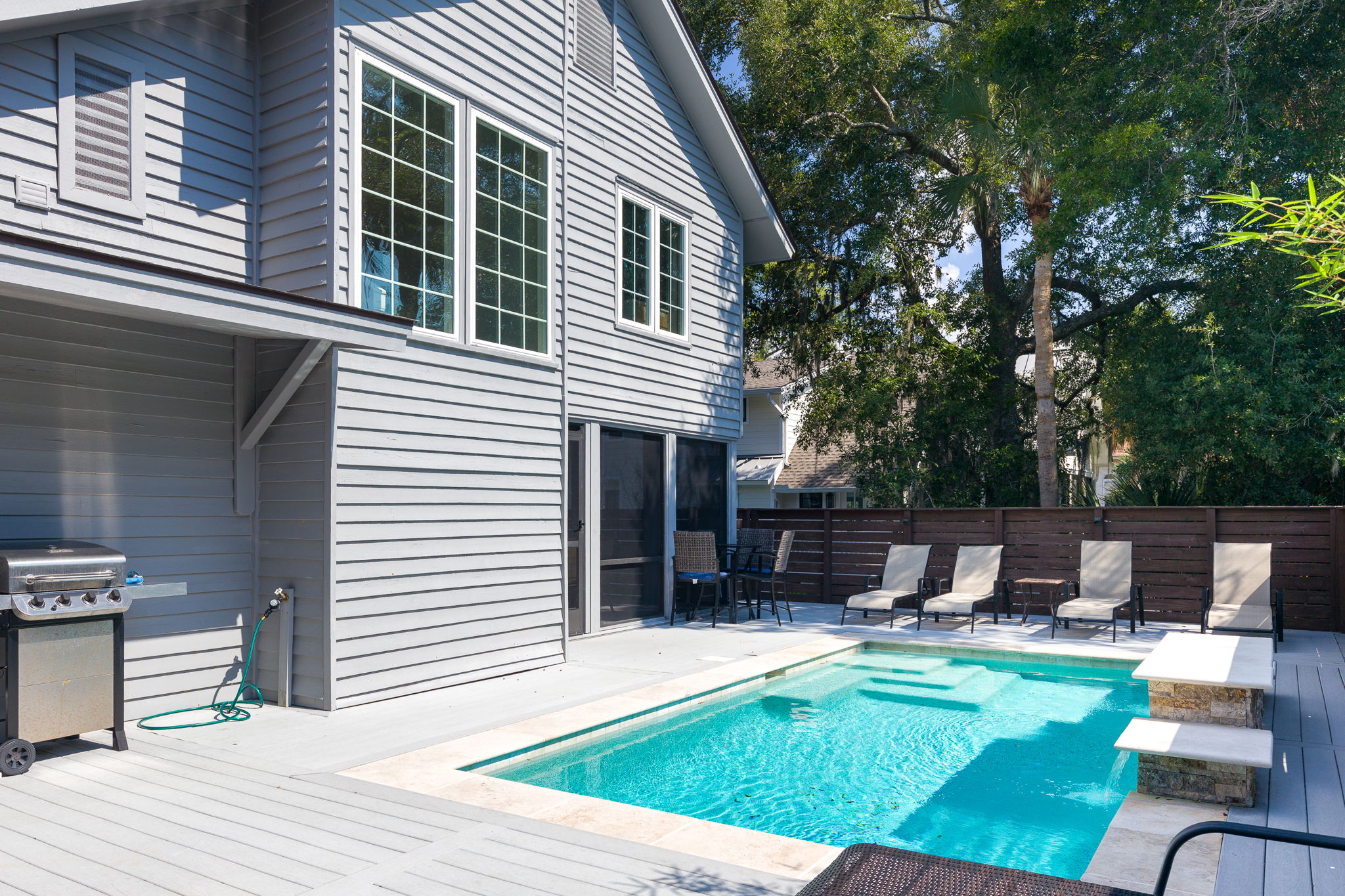 View of 1 Sea Hawk pool, deck and screened-in porch.