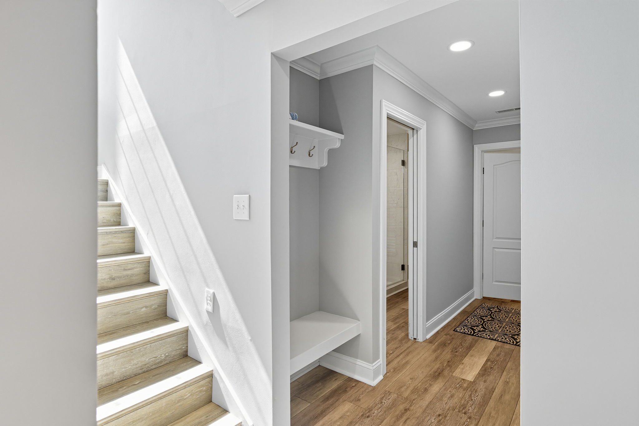 Stairs to the second floor lead to a In-law/nanny suite.
