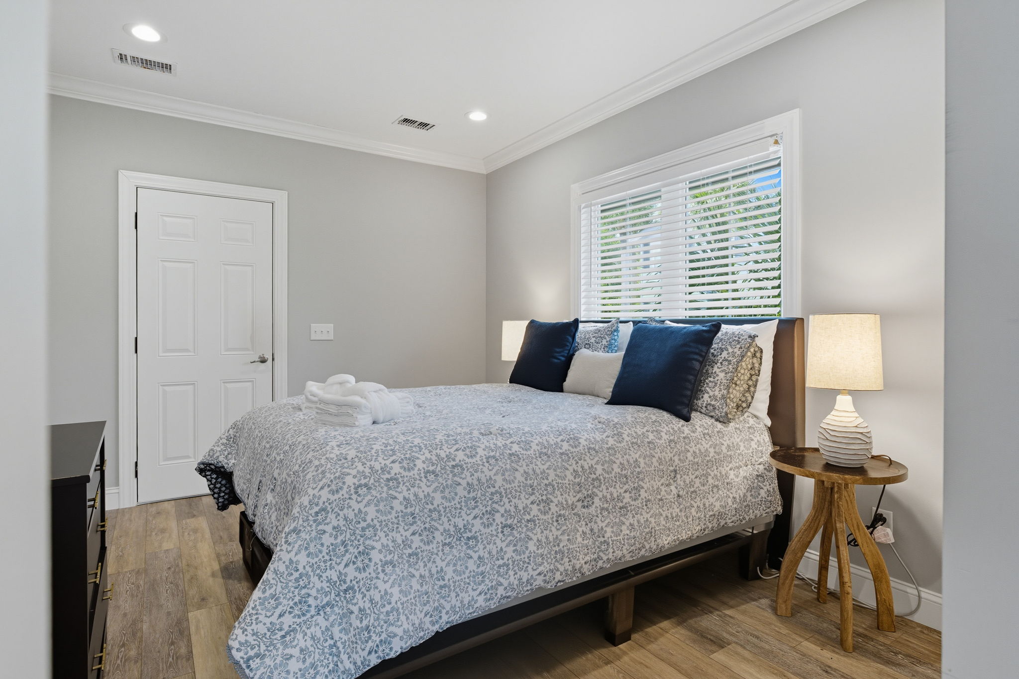 Queen bedroom in the Teen Annex has lovely natural light and its own door to the pool.