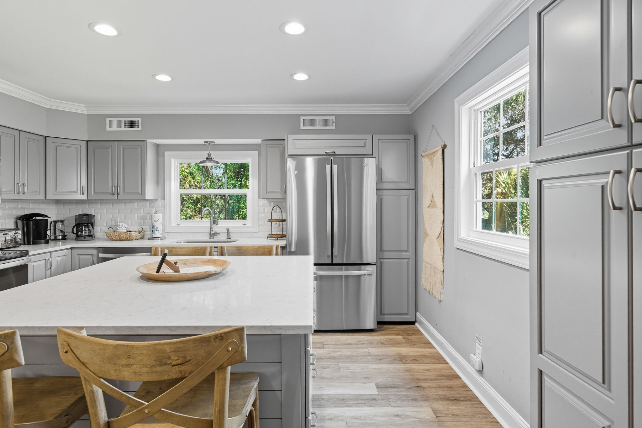 Kitchen with light from 2 aspects; the Island seats 4.