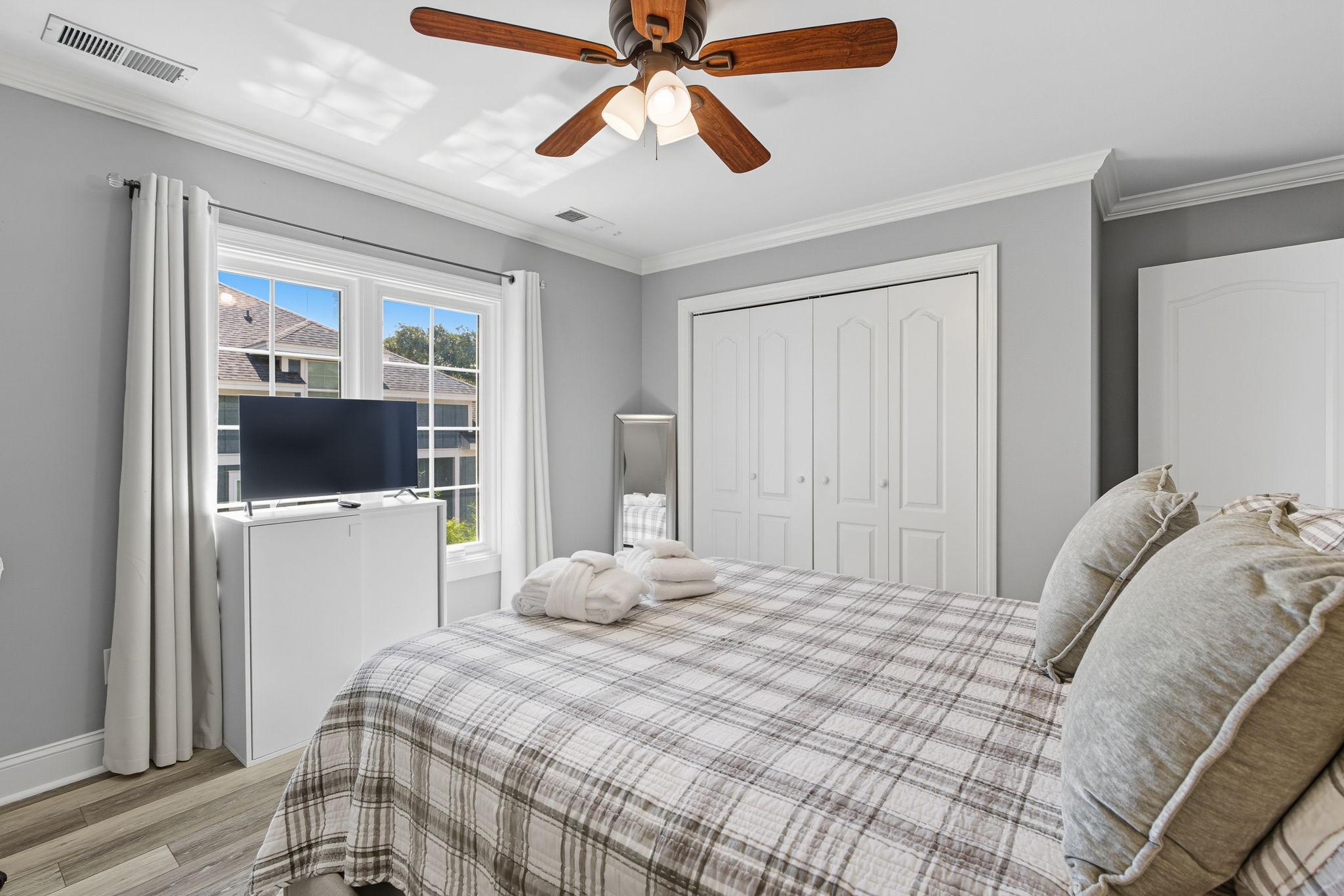 The Queen bedroom in the In-law/nanny suite has its own flat screen TV.