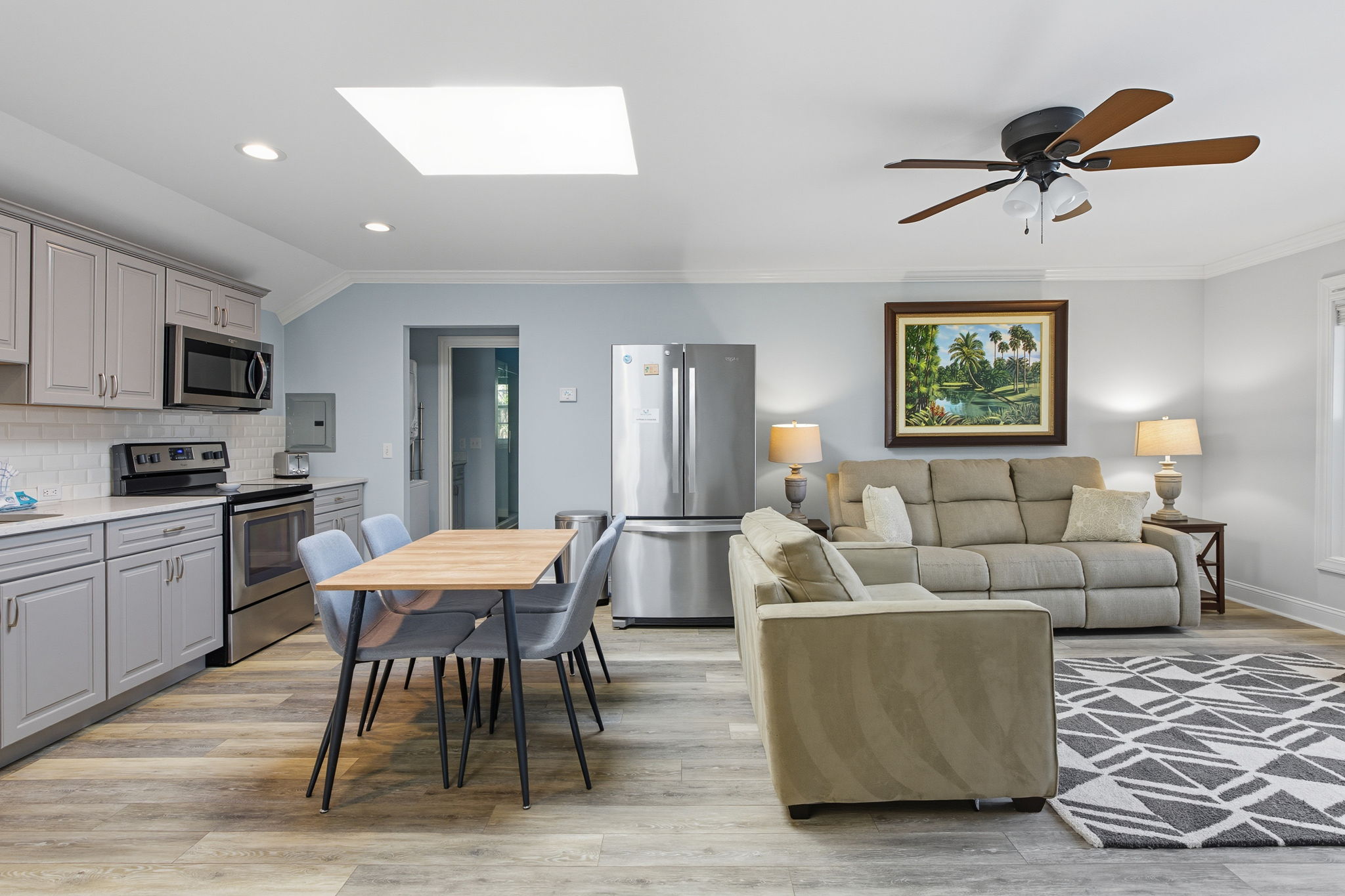 The living area in the in-law/nanny suite has generous comfortable lounge seating.