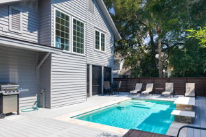 View of 1 Sea Hawk pool, deck and screened-in porch.