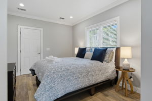 Queen bedroom in the Teen Annex has lovely natural light and its own door to the pool.