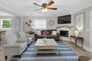 The landing opens to a cosy Living Room w/ electric fireplace.