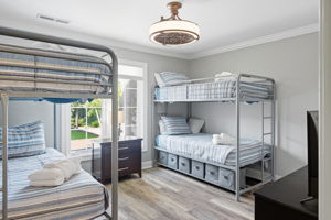 Bunkroom with two twin bunks & storage underneath..