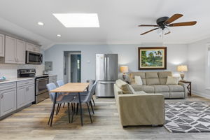 The living area in the in-law/nanny suite has generous comfortable lounge seating.
