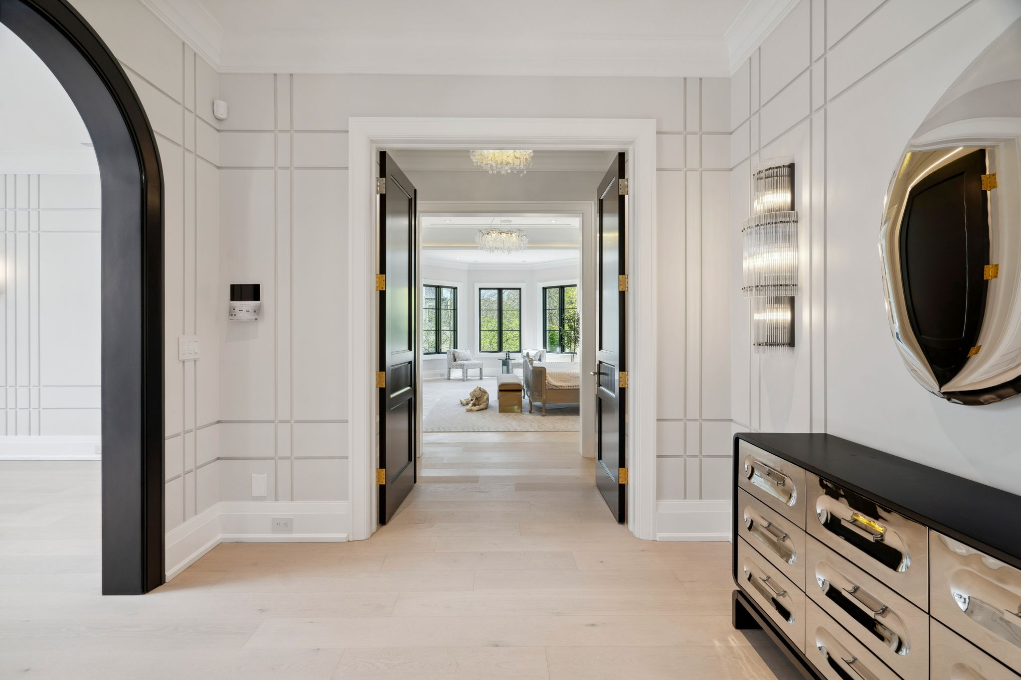 Hallway with arches at 1 Sunflower Court, showing depth and perspective. Photo by amazingphotovideo.com, site by cranemedia.com