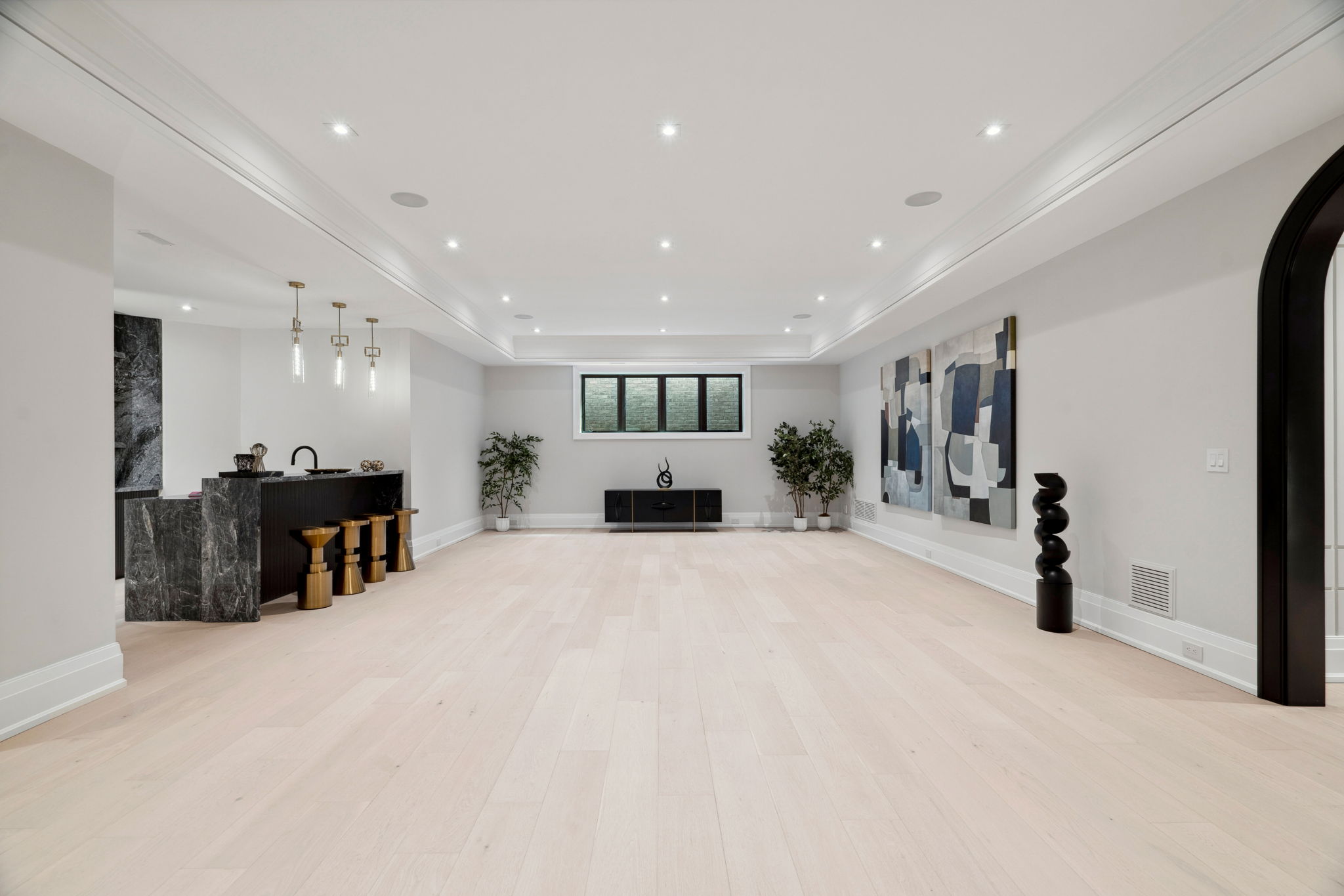 Basement hardwood flooring at 1 Sunflower Court by Miracle Construction. Photo by amazingphotovideo.com, site by cranemedia.com