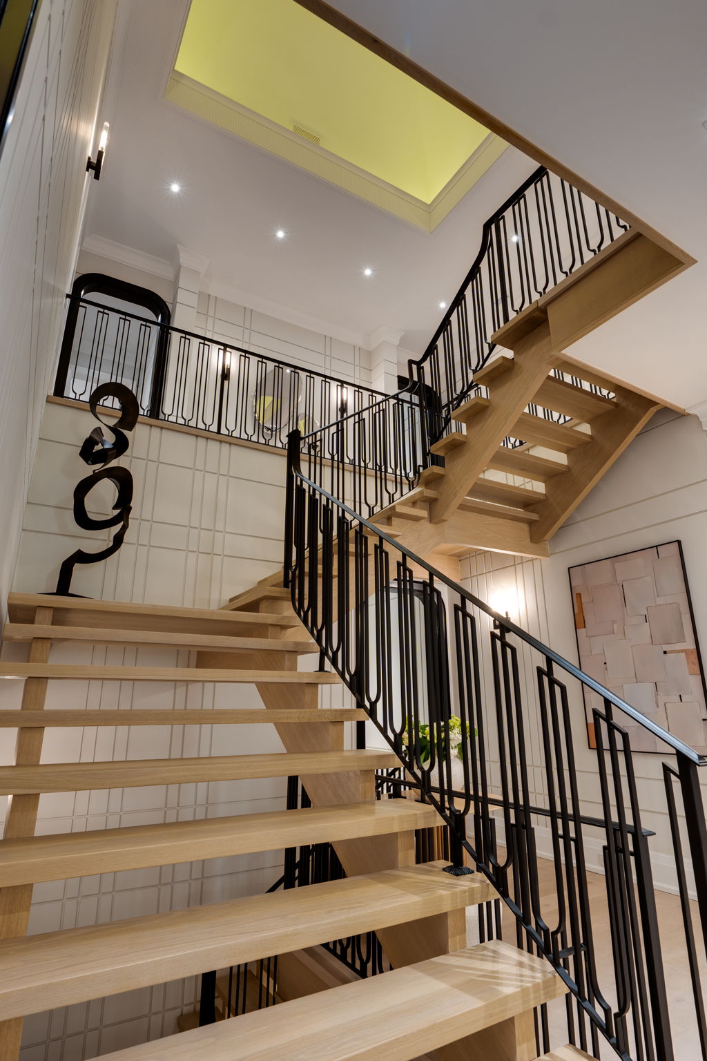 Miracle Construction Build: Grand interior staircase at 1 Sunflower Court. Site by cranemedia.com, Photo by amazingphotovideo.com