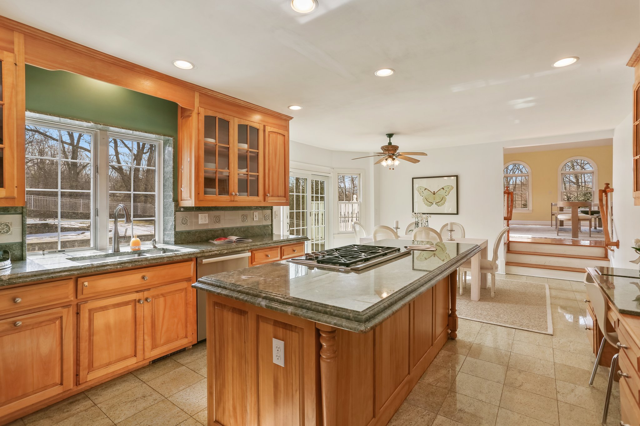 Gourmet Eat-In Kitchen with premium appliances & lustrous granite countertops and a wealth of cabinetry