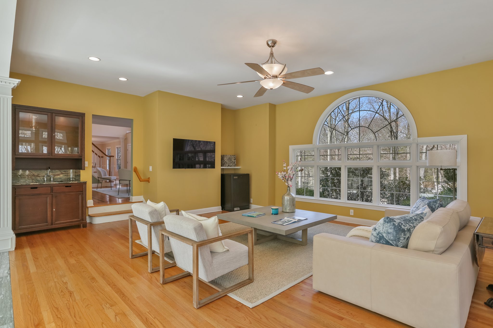 Sun Room with chic wet bar for entertainment and relaxation