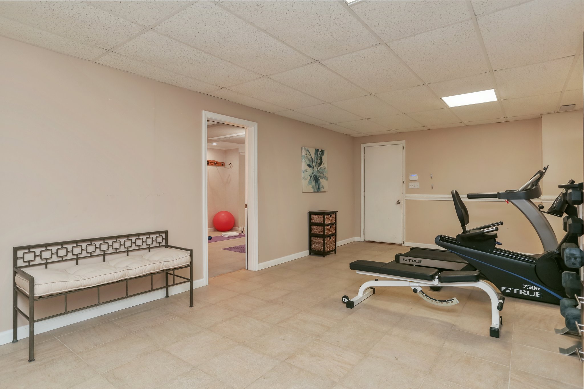 Right off the 2-car garage - enjoy this generous space for daily exercise.  A great space for your mud-room.