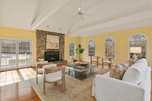 Great Room with French Doors that lead to a sizable deck, offering a perfect vantage point from which to enjoy the great outdoors.