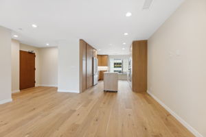 Foyer and kitchen - floors are natural white oak wood and sealed to protect for a guarantee 50 yrs by Anderson