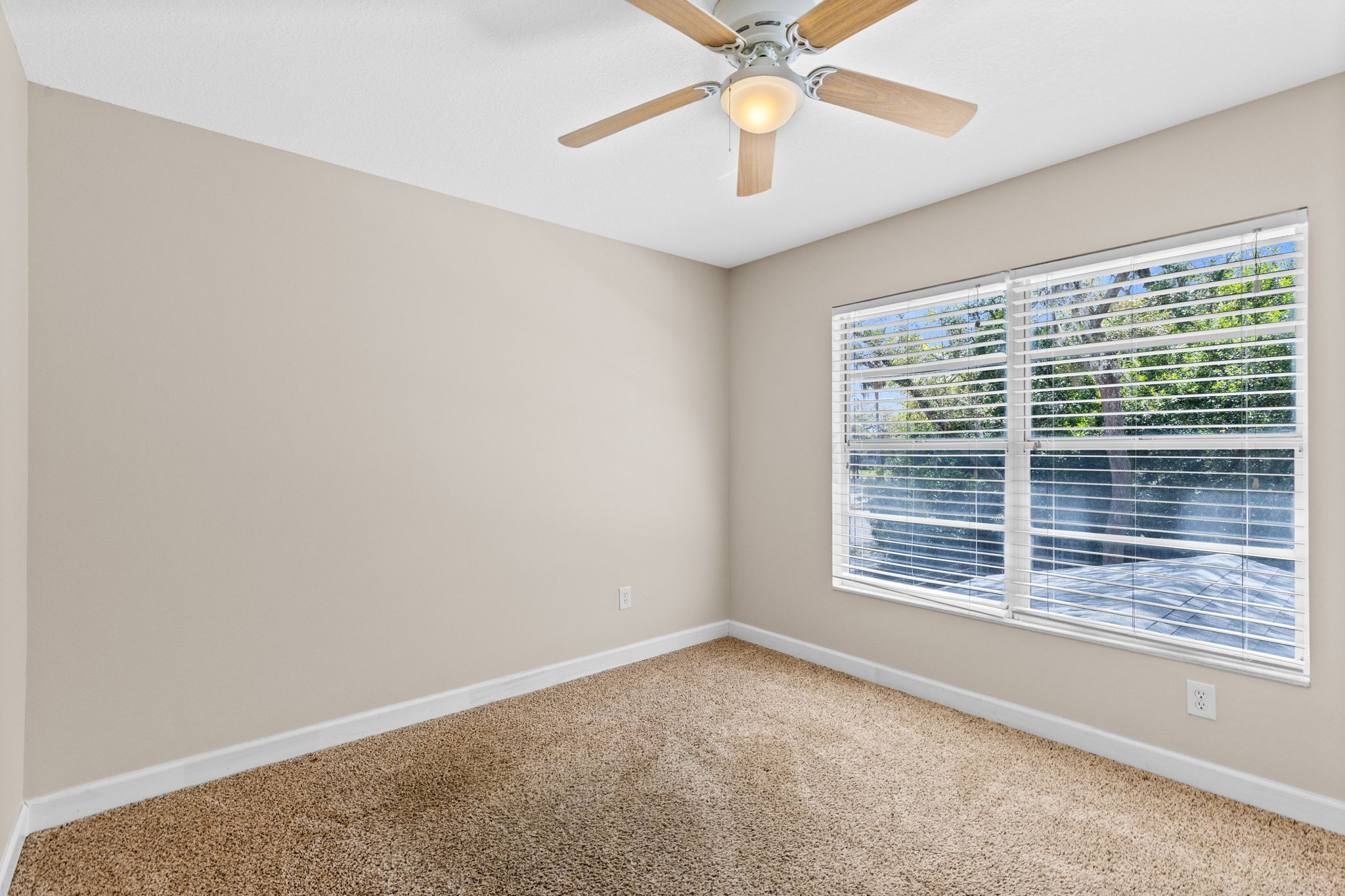 Spacious feel and natural light in the rear bedroom