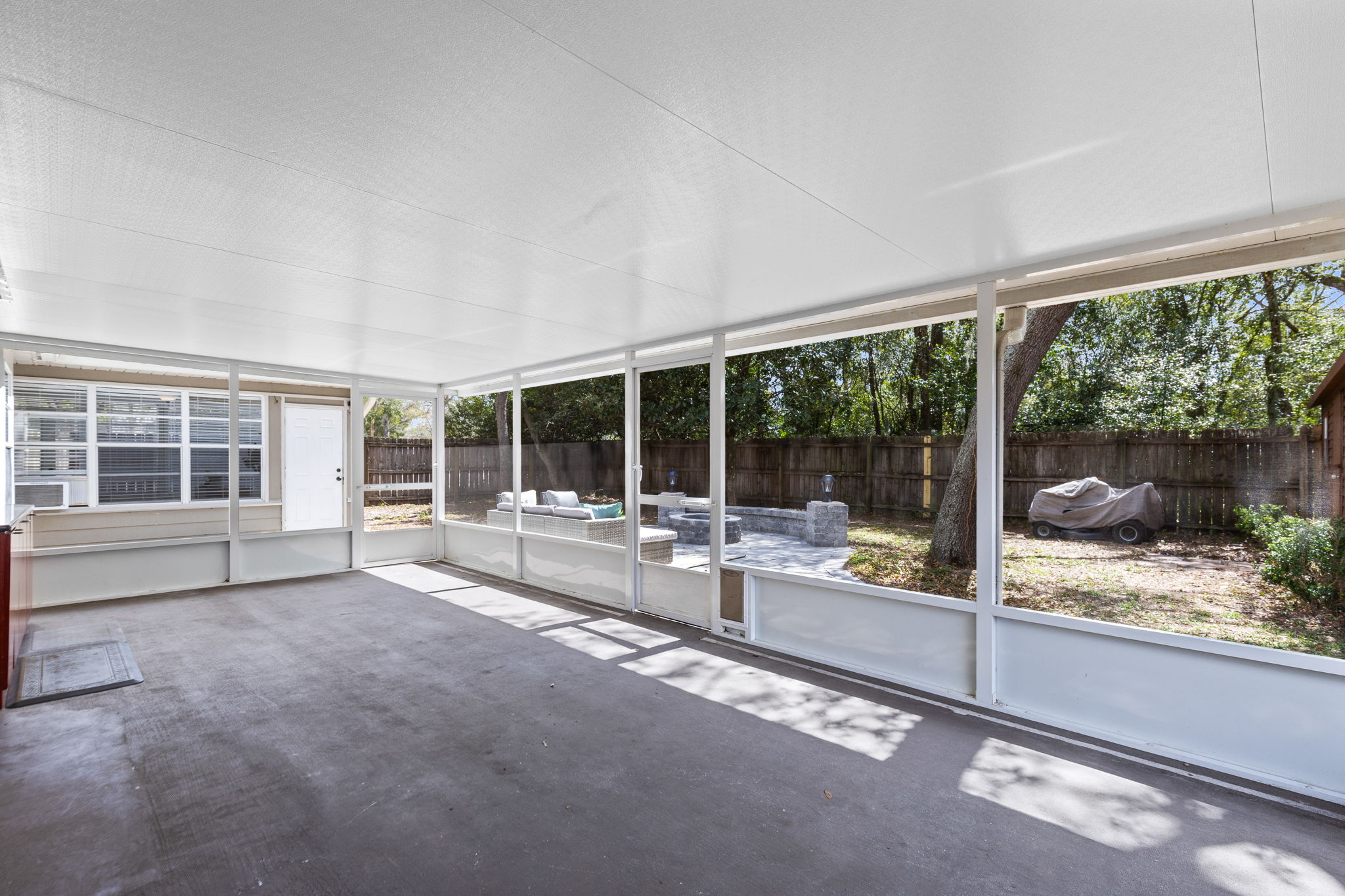 ~500 SF Screened porch overlooking backyard and patio entertainment area.