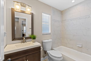 Ceiling hight tile wainscot in Full Second Bathroom upstairs