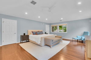 Primary Bedroom with two 11' x 5' walk-in closets.