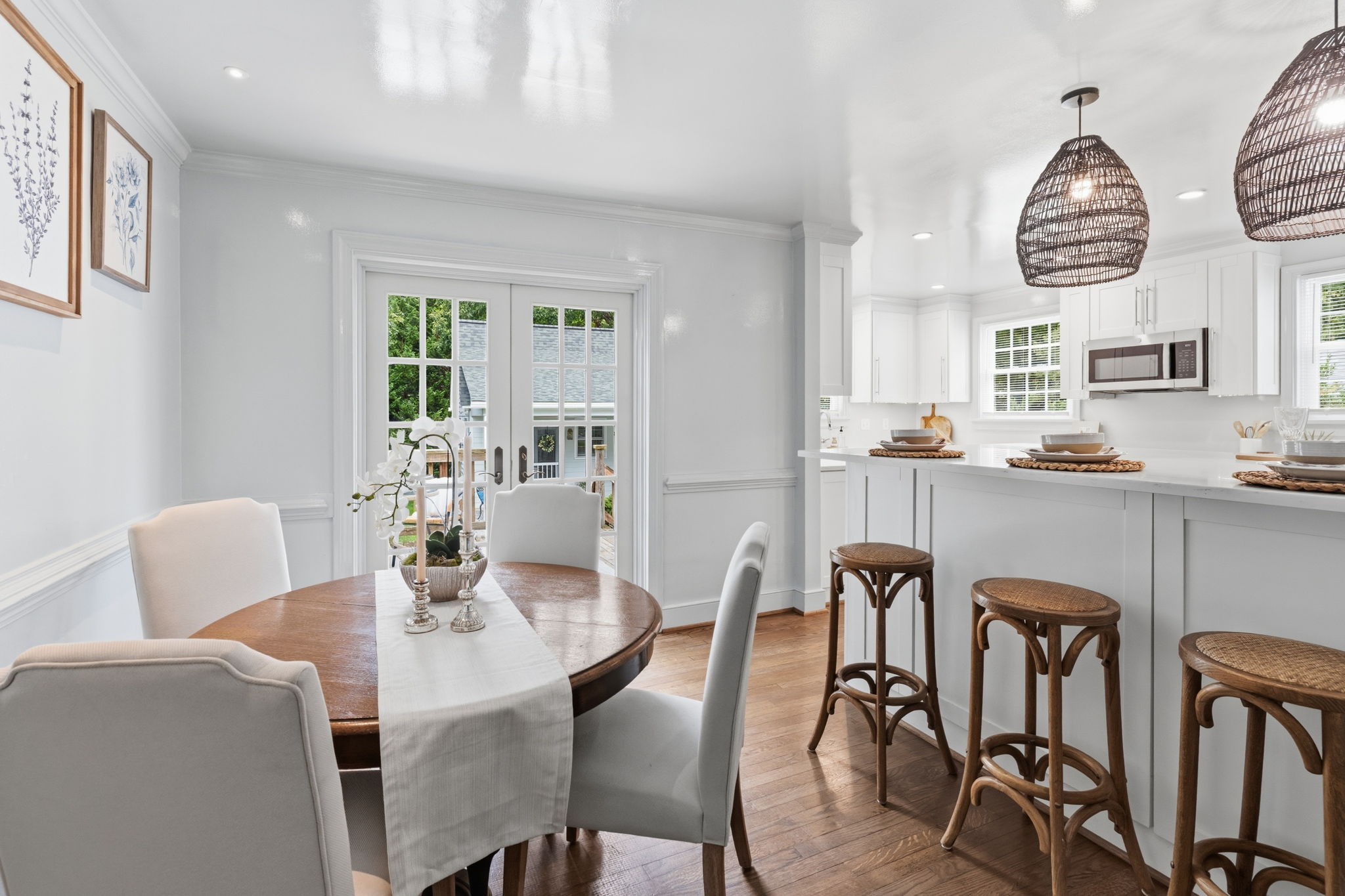 Dining area opens to the kitchen separated by a large peninsula with tons of counter space, storage and room for barstools.