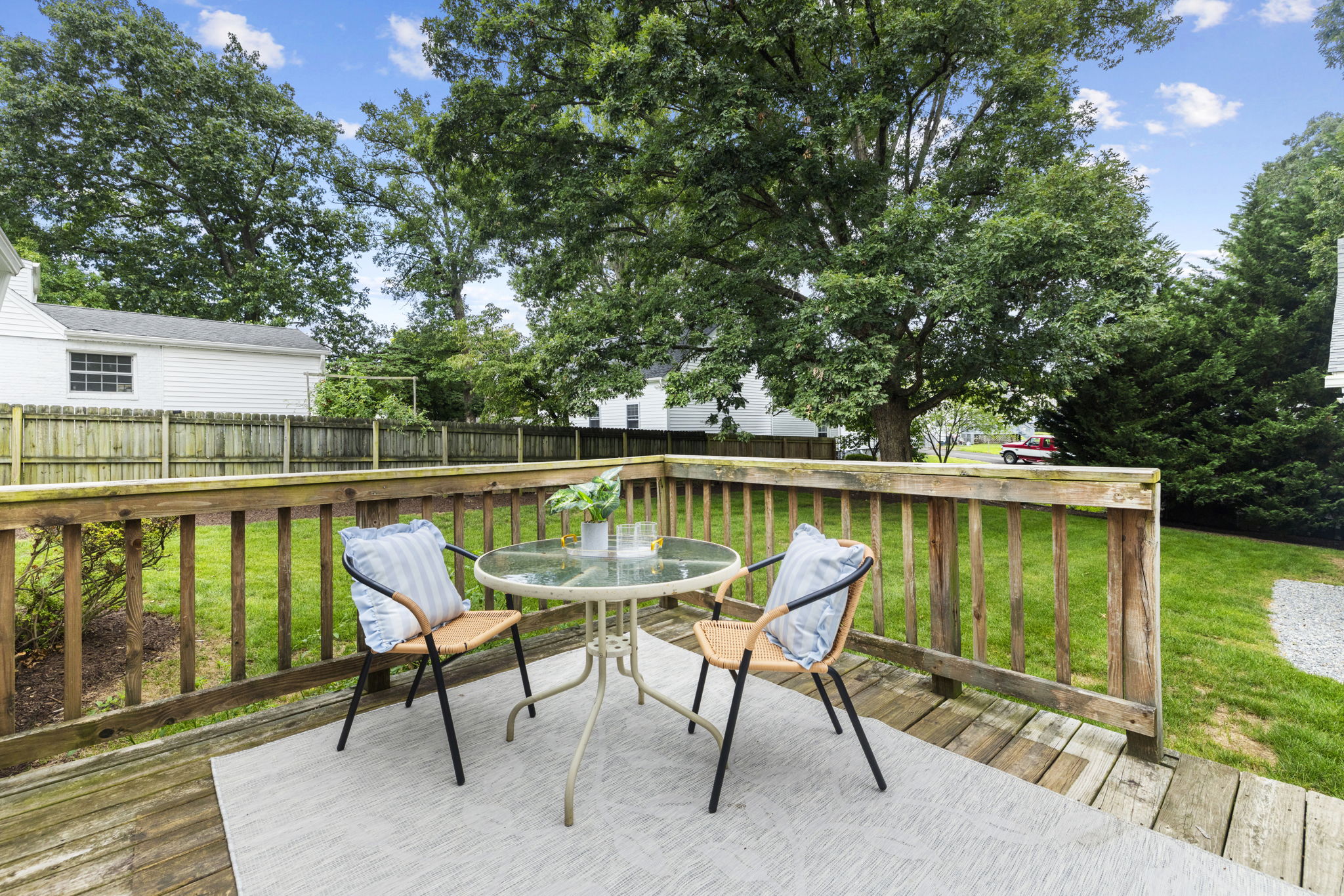 Wood deck is right off the kitchen dining area with French doors.