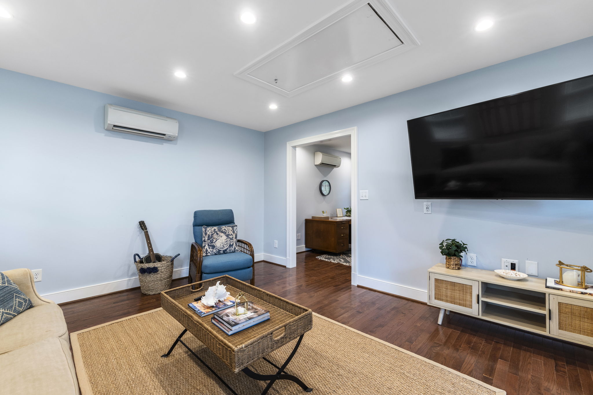 Detached building living room with mini split heat pump & oak hardwood floors.