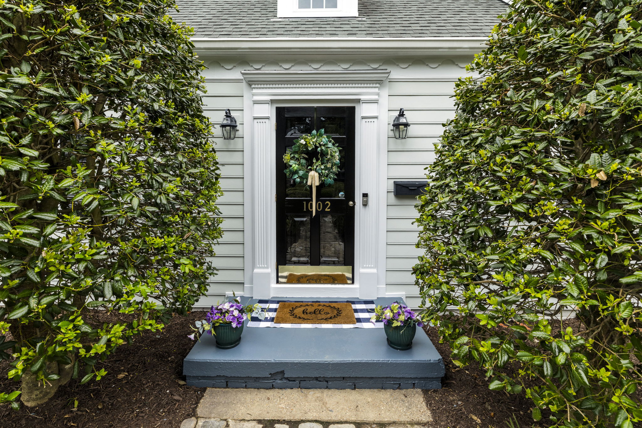 Front porch stoop with storm door.