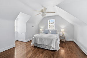 Large front 2nd floor bedroom with eave storage and recently refinished hardwood floors.  Shoe moulding has since been installed after photos!