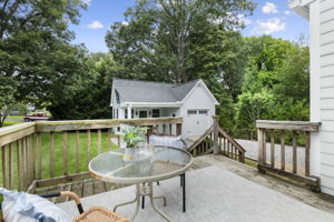 The back yard is massive with plenty of space for any number of activities and multiple spaces to sit and enjoy the weather.