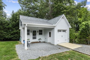 Custom built in 2018 this detached 1 car garage with a living room & office space is the ultimate extra space to make life easier and more enjoyable. A covered area with a ceiling fan and separate entries to the garage and finished space is the perfect spot for your hardscaped patio with drainage work already completed. Hardi-plank siding and PVC trim makes this extremely low maintenance.