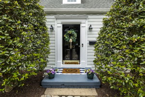 Front porch stoop with storm door.
