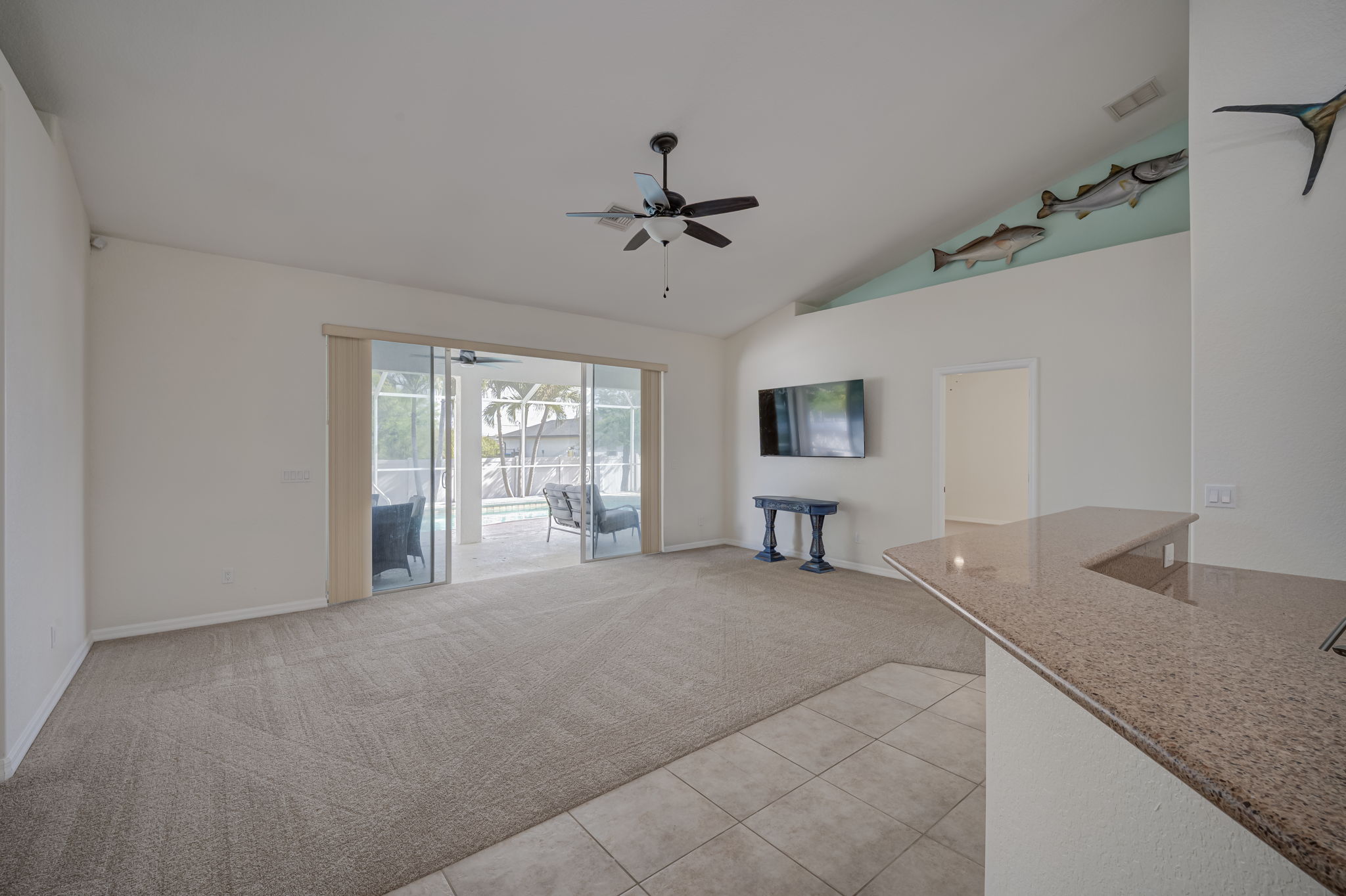 Kitchen with view to living room and pool