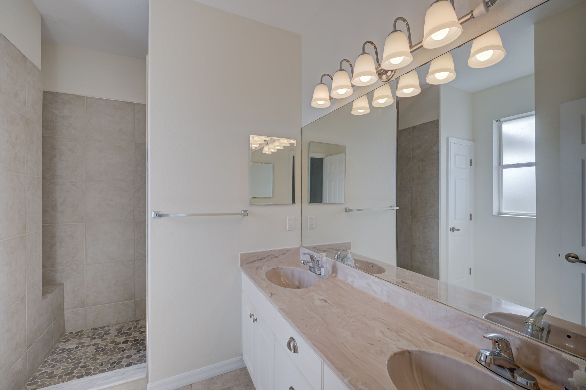 Primary bath with dual sinks and walk in shower
