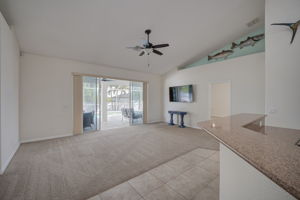 Kitchen with view to living room and pool