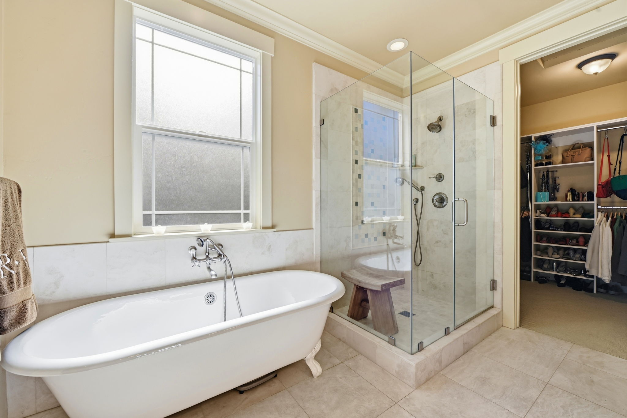 Sumptuous soaking tub in primary BR