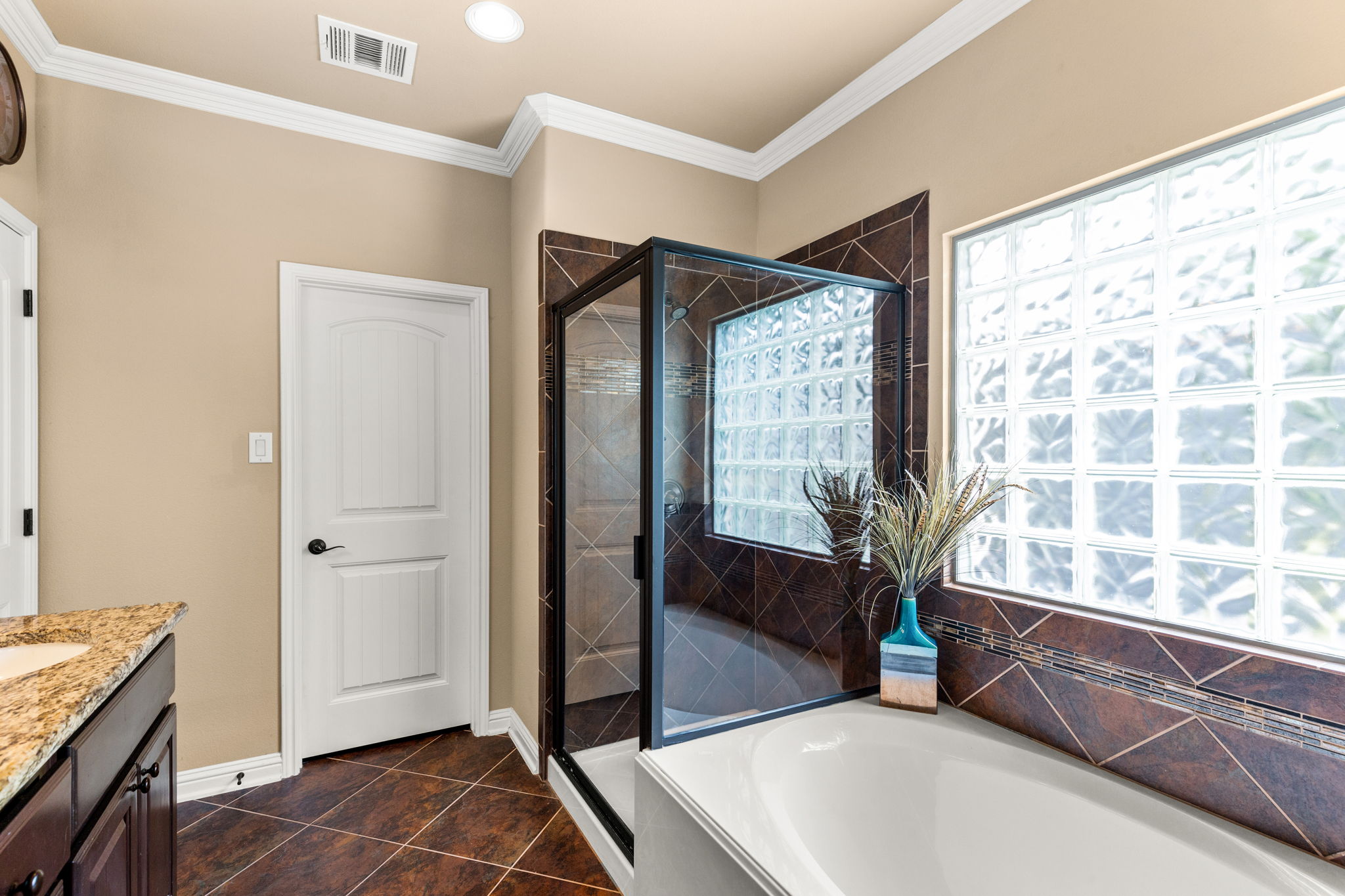 Garden tub & separate shower in primary suite