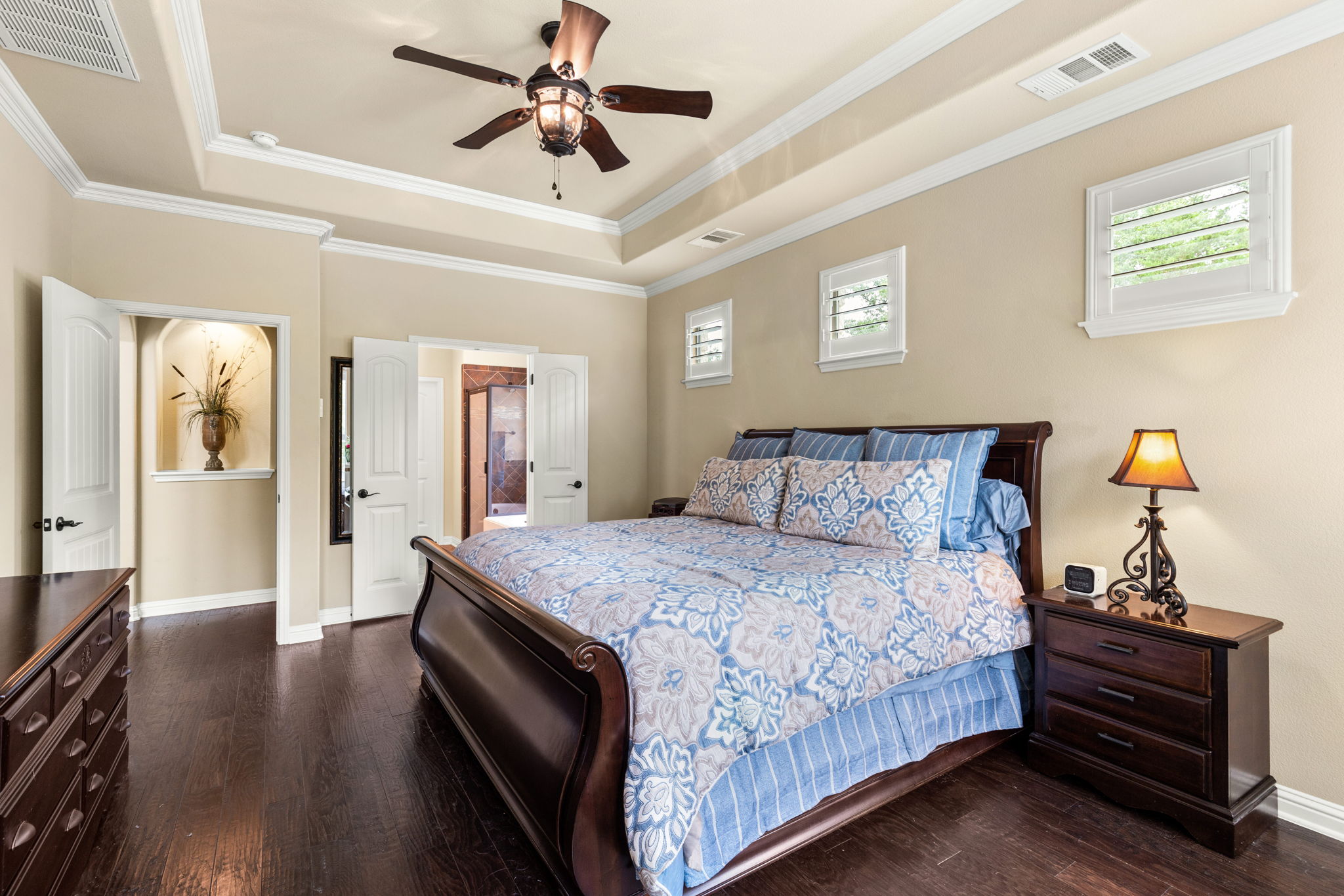 Tray ceilings and crown molding in primary suite