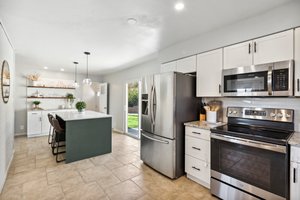 Kitchen With Floating Shelves, Dry Bar/Coffee Bar and New Eating Island