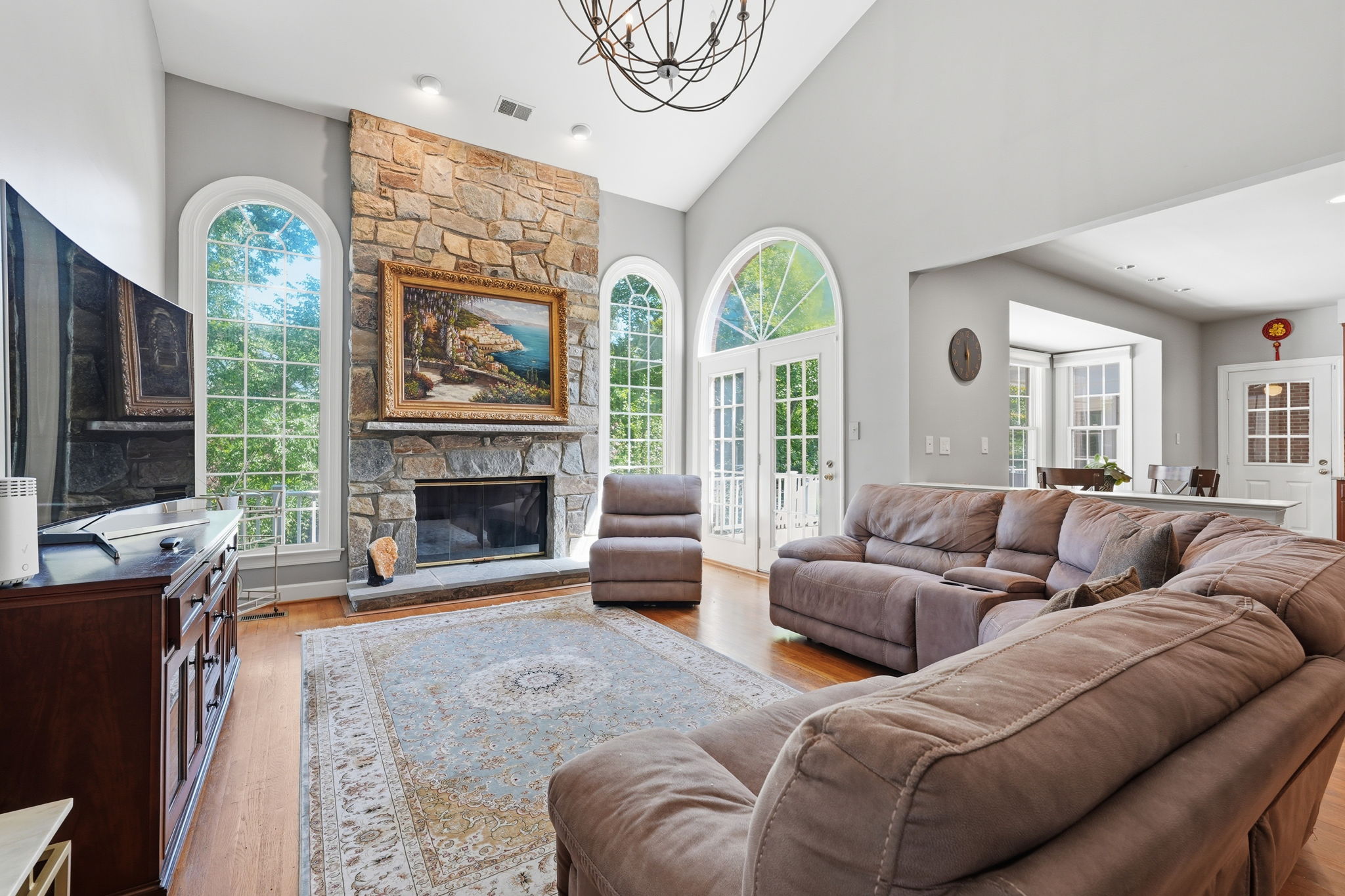 Two-Story Family Room with Stone Fireplace