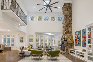 The 2-story great room with 22-foot stone fireplace.