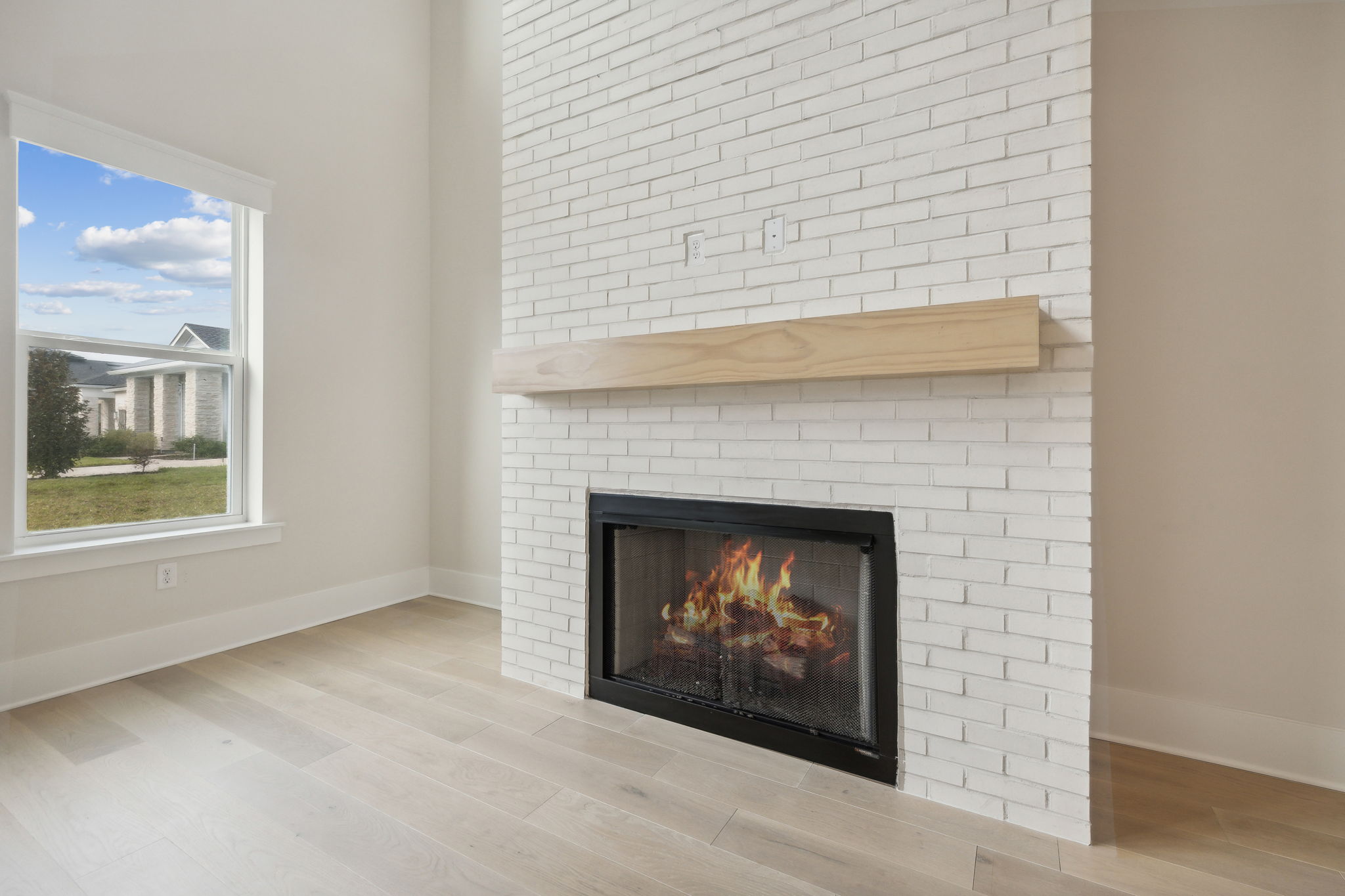 Gas Fireplace with Painted Brick Wall