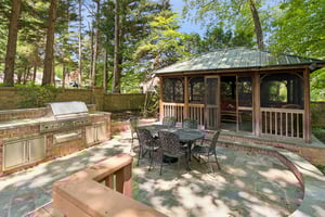 Flagstone Patio with Summer Kitchen with Screened in Patio