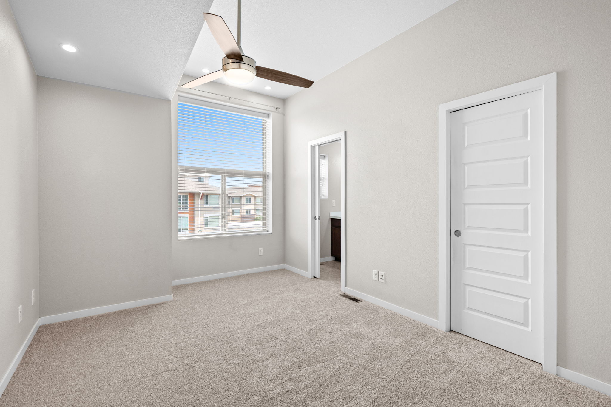 Primary Bedroom, Pocket Doors to Walk-In Closet and 3/4 Bathroom, Ceiling Fan, Can Lighting