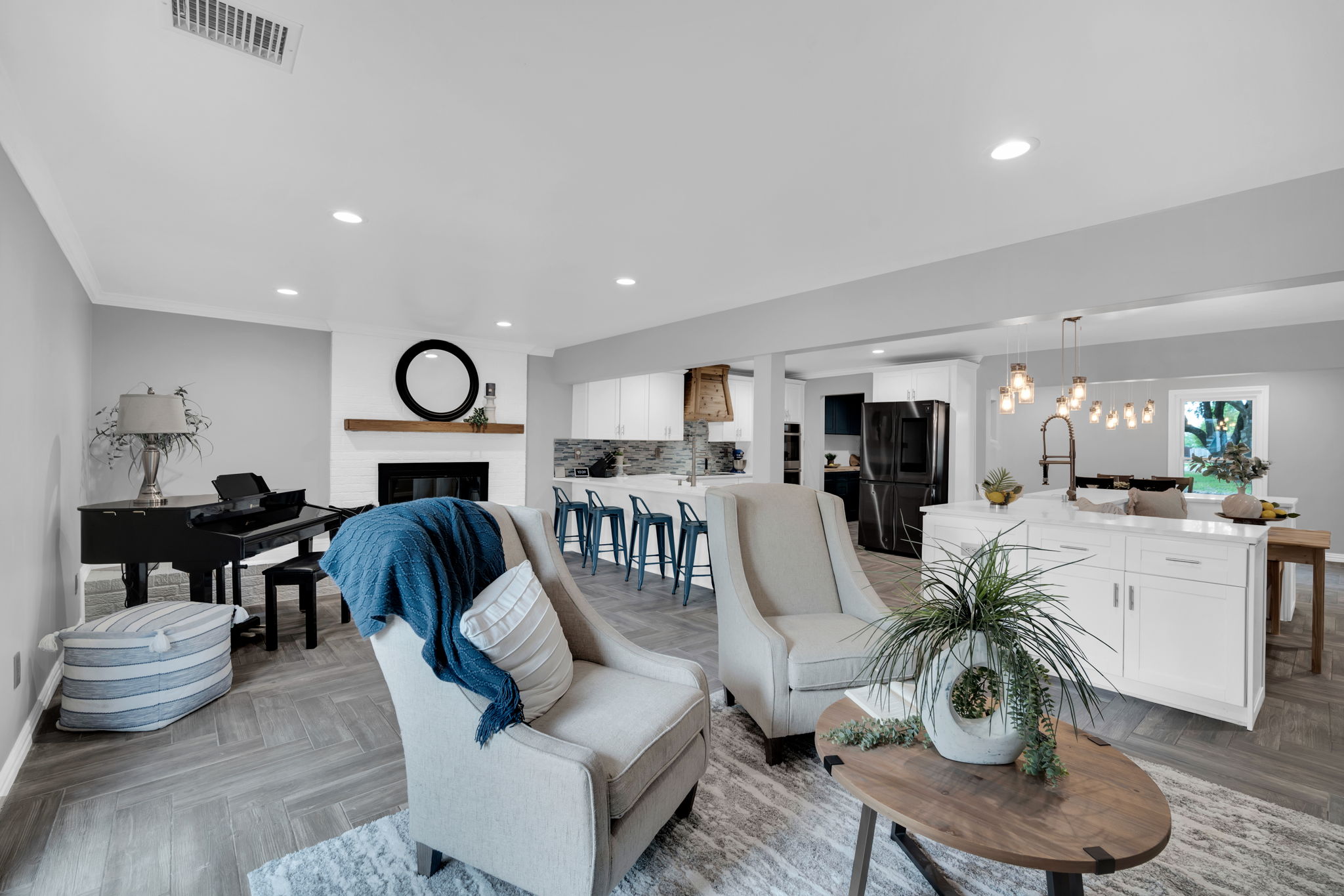 The living room is large enough to provide two defined living spaces for all those varied interests