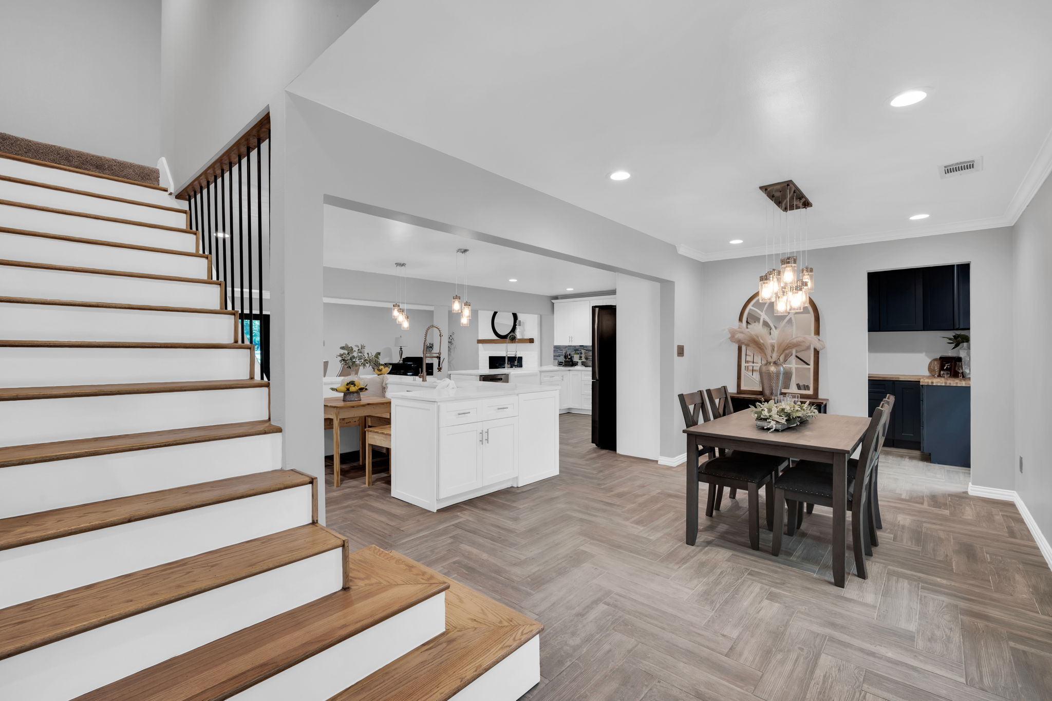 Intricate details catch the eye the moment you walk in the door and are greeted with an open floorplan