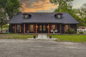 This Ranch style home brings a modern twist with a contrast between black and cedar finishes