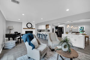 The living room is large enough to provide two defined living spaces for all those varied interests