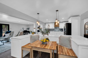 Wooden bench seating compliments the finishes while providing additional seating and storage