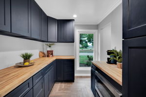 This butler's pantry is designed with efficiency and storage in mind